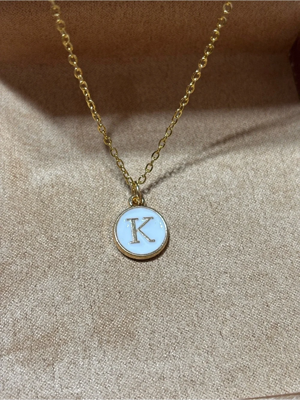 Gold tone initial K pendant necklace